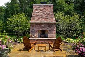 Warm, cozy and inviting are words friends will be using to describe your backyard if this attractive stone fireplace is the focal point. Outdoor Brick Fireplace Landscaping Network