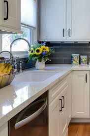 For example, you can choose a matte black and chrome pull to complement a chrome faucet and matte black appliances. Aniela Vincent Modern White Cabinets With Black Handles Before After Kitchen Renovation Interior Design Real Estate Staging