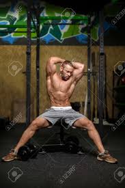 Download gym background stock photos. A Portrait Of A Male With Flexing Muscles On A Gym Background Stock Photo Picture And Royalty Free Image Image 86492378