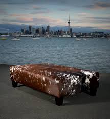 A Large And Beautiful Cowhide Ottoman Coffee Table With Wooden Legs This Is A Very Unique Hide And The Res Cowhide Ottoman Western Furniture Ottoman Furniture