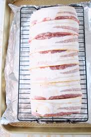The bacon helps seal in moisture and my oven roasting method is foolproof. Bacon Wrapped Balsamic Pork Loin Recipe Whitneybond Com