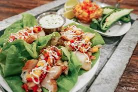 These are by far the best pork tacos we've had—and we've tried plenty. Healthy Recipe Fish Taco Lettuce Wraps With Mango Salsa And Lime Crema Fitbit Blog