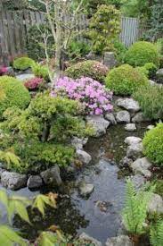 Beautiful Design Of Japanese Garden With Flowers Small Japanese Garden Japanese Garden Japanese Garden Plants