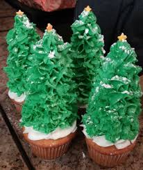 Christmas Tree Cupcakes Made By Pipping Buttercream On To An Upside Down Ice Cream Cone And Sprinkled With Christmas Tree Cupcakes Butter Cream Holiday Recipes