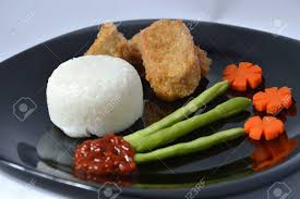 Thick rice noodles in tamarind fish broth topped with local mackerel fish, sliced cucumber and onions. Otak Otak Bandeng A Milkfish Fry Blend On Black Plate Stock Photo Picture And Royalty Free Image Image 23343323