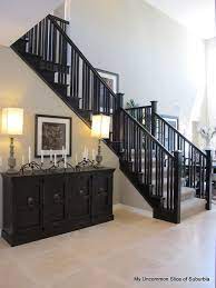 Dining Room Stairs Black Banisters White Steps Black And White Decorated Risers Home Decor Home Staircase Design Black Stair Railing