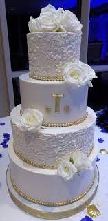 4 Tier Buttercream Wedding Cake Decorated With Buttercream Lace Edible Gold Borders And Gold Wedding Cake Buttercream Wedding Cake White And Gold Wedding Cake