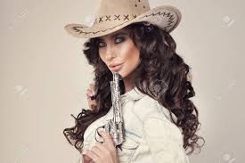 She also removes her panties but. Portrait Of Sexy Brunette Cowgirl With Revolver Looking At Camera Stock Photo Picture And Royalty Free Image Image 26398750