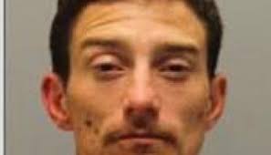 Suspect arrested after reporting himself to police