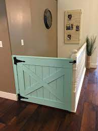 Sliding barn doors are a fun decorating trend that go beyond the farmhouse! Doordodoor Barn Door Style Baby Gate