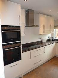 lovely acrylic doors in cream gloss stada quartz worktops and siemens appliances kitchen world kitchen kitchen interior