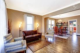 Living Room Interior With Hardwood Floor Leather Couch And Light Brown Living Room Decor White Lights Living Room Trendy Living Rooms