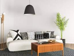 The room also features a lucite table that adds a modern touch. How To Find The Right Throw Pillow For Your Sofa Architectural Digest