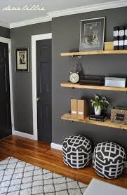 This modern living room showcases bright orange walls contrasted with a grey sofa, round coffee table, and pendant lights. Malerei Wande Ideen Wohnzimmer Warm Grey 53 Ideen Fur 2019 Zimmereinrichtung Living Room Warm Living Room Grey Living Room Paint