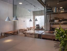 The Glass Enclosed Kitchen Is Positioned Rather Rebelliously At The Entrance To The Restaurant Making It Clear To Restaurant Interior Interior Kitchen Design