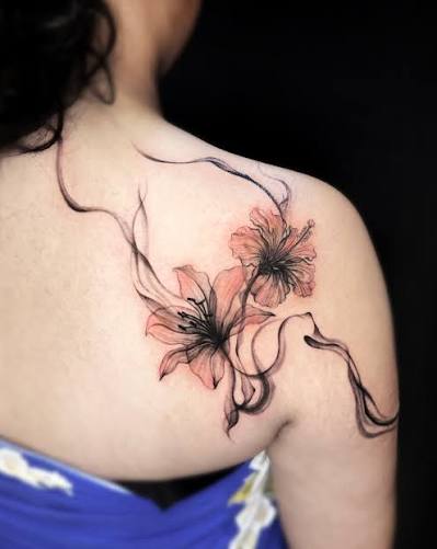 Watercolor hibiscus flowers by Eak. Soft pigment gradients with smoky black flow lines to create movement across the shoulder. 🎨 DM to book. #tattoo #bangkoktattoo #thailandtattoo #watercolortattoo #colortattoo #hibiscustattoo #floraltattoo ...