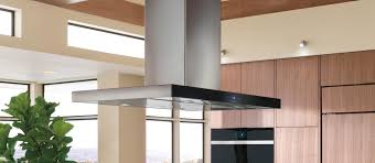 The kitchen features a farm sink and island cooktop with inset cabi… Wolf 42 Cooktop Island Hood Black Vi42b