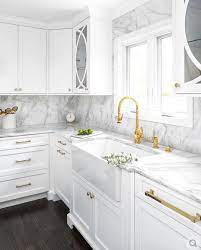 Okay, going with the white kitchen cabinets with gold hardware theme, the next thing to shop for was the gold lighting, faucet and hardware. White And Gold Kitchen Design In 2021 Classic White Kitchen White Shaker Kitchen Shaker Kitchen Cabinets