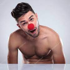 Amazed young naked man with red clown nose Stock Photo by ©feedough 49915897