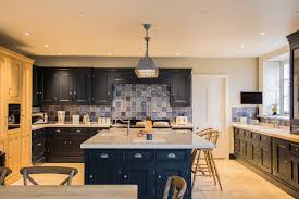 Furniture assembling of custom new cabinets in modern kitchen. Hinges Explained Blog