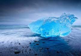 Blue Iceberg Appearing To Glow On Black Sand Beach Iceland Photos Nature Photos Photo