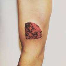 Red ink diamond tattoo on belly. Red Diamond