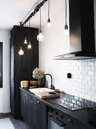 Here are a few key decor items that are great for kitchen decorating. 15 Modern Ways To Slay The Black And White Decor Trend Black Kitchen Faucets Kitchen Design Small Kitchen Interior