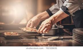 Hand Of Man Take Cooking Of Meat With Vegetable Grill Chef Cooking Wagyu Beef In Japanese Teppanyaki Restaurant Teppanyaki Restaurants Japanese Beef Teppanyaki