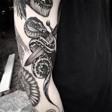 Scary snake tattoose on the leg. 75 Snake Tattoo Ideas Snake Tattoo Body Art Tattoos Tattoos
