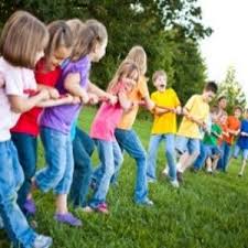 The kids have to coordinate getting on opposite sides of the band and then going in the same direction with one holding. Team Building Games Http Teambuildinggames Co Building Games For Kids Team Building Games Team Building Activities