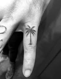 A palm tree is a symbol for an island life. The Source Of Life Tree Tattoos And Meaning 911 Weknow