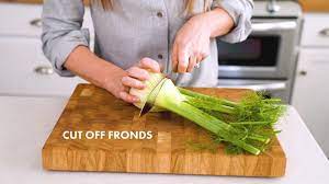 To get long slices of fennel, first cut off the stalks and fronds and set them aside. How To Cut Fennel A Couple Cooks