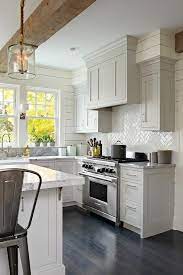 The astounding 33 beautiful modern farmhouse exterior design ideas 20 in small modern farmhouse exterior image below, is segment of … farmhouse style bedrooms farmhouse decor farmhouse lighting farmhouse ideas vintage farmhouse country farmhouse door design. Light Gray Shaker Kitchen Cabinets With Glossy White Herringbone Tile Backsplash Tra Kitchen Remodel Small Farmhouse Kitchen Design Modern Farmhouse Kitchens