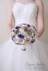 Quality dewdrop partially open rose accented with greenery, white baby breath, and ruffle flowers. Royal Blue Brooch Bouquet Gold Ivory Brides Wedding Bouquet Etsy
