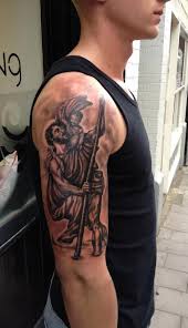 The spiritual tattoos lend a sacred touch to your personality. 29 Religious Saint Christopher Tattoos