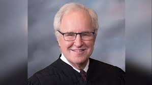 In cities in Cowley County 26 lawyers with active licenses registered as of  May