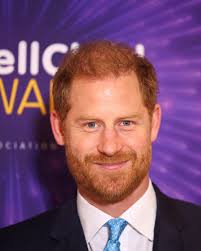 All smiles, Prince Harry returns to the UK for children's charity event