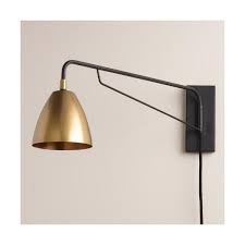 A practical light for use in a bathroom, hallway or workspace, this wall sconce offers bright illumination where you need it most. Cost Plus World Market Brass Nook Pivoting Wall Sconce Sconces Bedroom Adjustable Wall Sconce Sconces Living Room