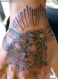 These are the tattoo designs which involve brass knuckles. Tattoo Of Brass Knuckles Old School Hand