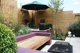 The distribution of plants look good with the limited area provided. Fire Pit Courtyard Gardens Design Small Courtyard Gardens Backyard Garden Layout