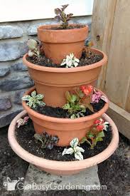 All the runoff from the previous pot drips into the plants below, so you only need to place a little dish the whole style of this diy tiered hanging pots is wonderful and amazing!i love your idea!thank you. How To Make An Easy Diy Tiered Planter Get Busy Gardening