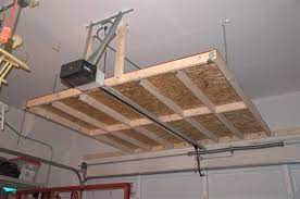 Use diy overhead garage storage to make room for cars. 13 Creative Overhead Garage Storage Ideas You Should Know Diy Overhead Garage Storage Garage Ceiling Storage Hanging Garage Shelves