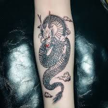 Another great and spectacular fantasy kind of dragon tattooed on upperback of a men. Dragon Tattoos In Arm Tattoos Gallery