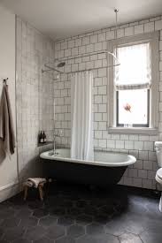 Its graceful lines and regal appeal give it an inviting look of pure luxury. The Shower Tile Ideas Are Endless White Bathroom Tiles Bathroom Interior Design Bathrooms Remodel