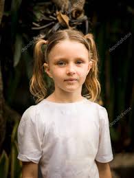 I i currently use a med ash blonde but not happy with it. Close Up Portrait Of Pretty Little Girl Blue Eyes And Blond Hair Caucasian Girl With Two Ponytails Dark Brown Background Bali Indonesia 452697522 Larastock