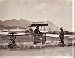 Traveling in a sedan chair, India— 1920s.