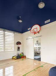 Dillon Kyle Architecture Fun Boy S Playroom Basketball Court With Painted Blue Ceiling Sliding Door On Ra Basketball Room Basketball Bedroom Kids Sports Room