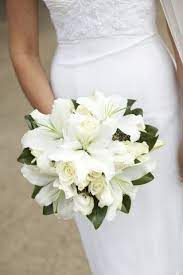 A whimsical harry potter wedding at the historic post office with rose gold details, king protea bouquets and fanciful lighting by caitlin gerres. Beautiful Bouquet St Joseph Lilies My Favorite Weddingbouquets Lily Bouquet Wedding Purple Wedding Bouquets White Wedding Flowers