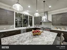 The marble, subway tile backsplash is a luxurious touch. Modern Traditional Image Photo Free Trial Bigstock