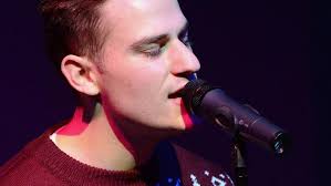 Local Voice contestant holding Strand Theater concerts